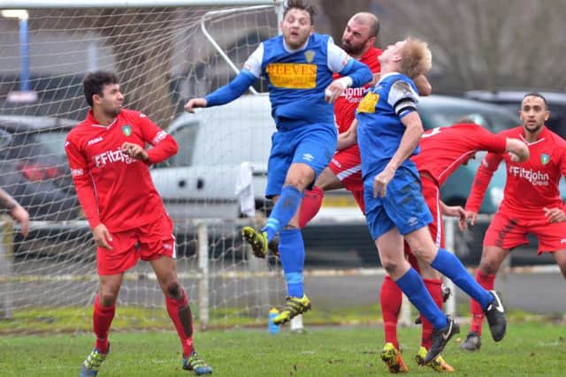 Action from Spalding United's 0-0 draw with Kidsgrove (red) last weekend. Photo: Tim Wilson.