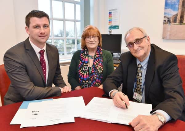 Matt Ditchfield CEO of Success for All Foundation with Couns June Stokes and John Holdich at Peterborough Town Hall signing paperwork EMN-171101-000444009