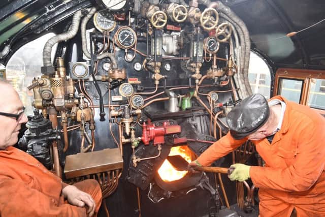 Steam test day for the Squadron 92 locomotive at Nene Valley Railway after 8 and a half years of renovation. Fireman  John Wood on the footplate EMN-171101-224103009
