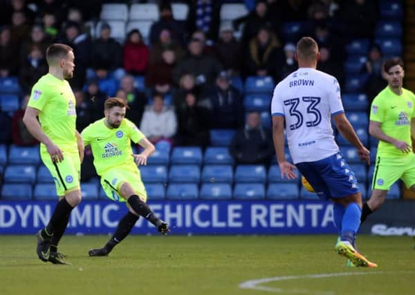 Gwion Edwards of Peterborough United shoots at goal which leads to the opening goal of the game. Picture: Joe Dent