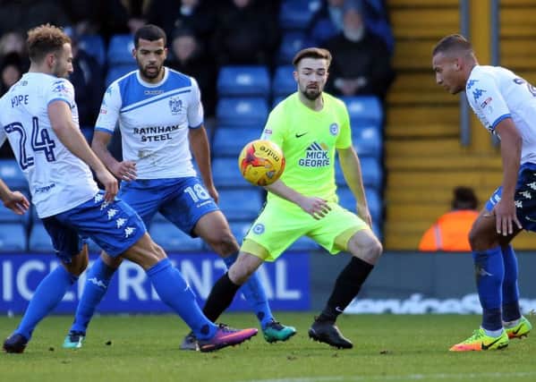 Gwion Edwards of Peterborough United is closed down by the Bury defence. Picture: Joe Dent