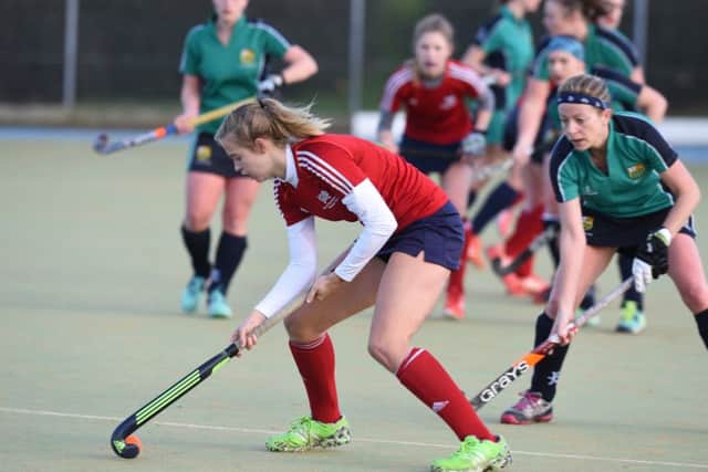 Jeorgia Carr (red) in action form City of Peterborough against St Ives. Photo: David Lowndes.