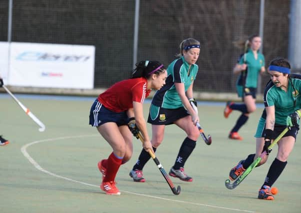 Hat-trick heroine Tierney Augustine (red) in action for City of Peterborough Ladies against St Ives. Photo: David Lowndes.