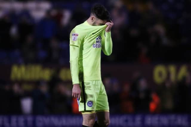 Michael Smith of Posh tries to hide his feelings after the final whistle at Bury. Photo: Joe Dent/theposh.com.