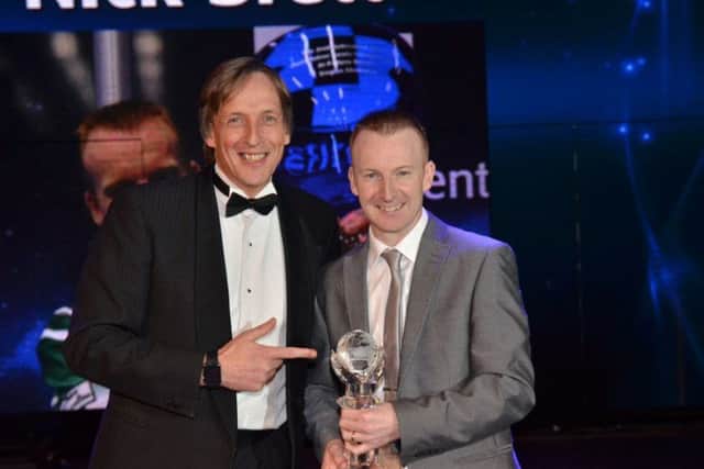 Nicky Brett (right) receives the World Bowls Tours Players Player of the Year award from Potters Resort managing director John Potter.