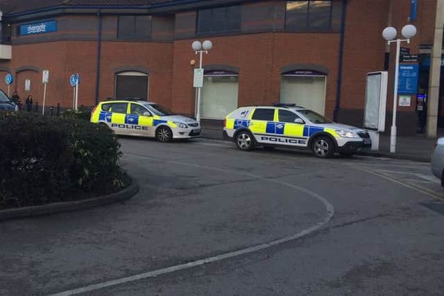 Police at the scene of an incident at Rivergate Arcade