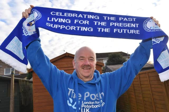 Mick Robinson, the Posh stato, who is to attend his 900th Posh game on Saturday. He is holding the ticket for the last game he missed EMN-170117-181034009