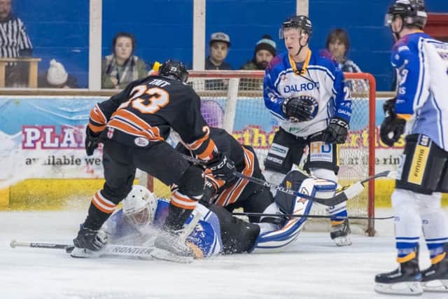 Phantoms netminder Janis Auzins protects the puck from Telford's Warren Tait and Joseph Aston. Picture: Tom Scott