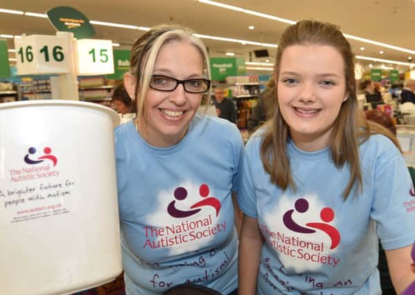 Charity bag packing at Morrison's store,  Lincoln Road  Cherie Burkitt and Teigan Sherman from  Red Rock Recruitment collecting for the National Autistic Society EMN-171201-172004009