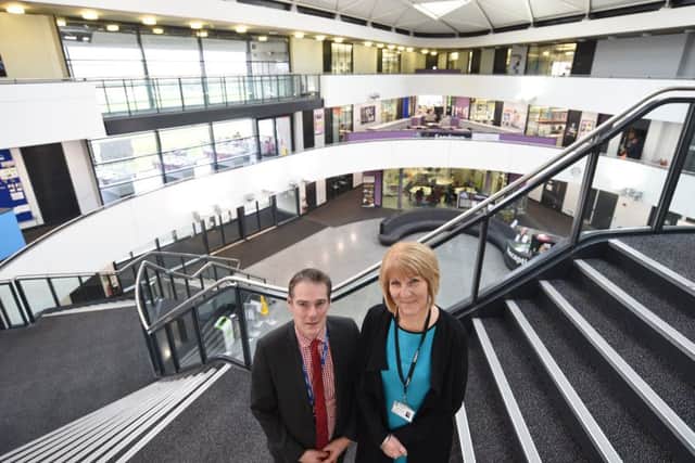 Principal at Thomas Deacon Academy  Julie Taylor with Scott Hudson, Principal of Voyager Academy at TDA EMN-170901-162614009