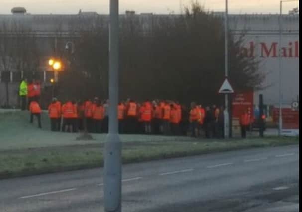 Staff outside Peterborough's Royal Mail centre during a previous gate meeting. PHOTO: Andy Simmo