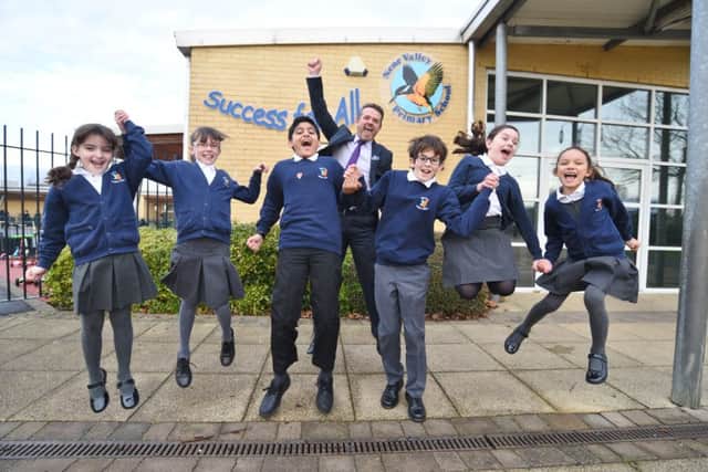 Sophie Reid, Katie Yule, Talaal Zubair, James Law, Emily Hurst and Alisha Robinson celebrating their OFSTED result at Nene Valley primary school with head teacher Stuart Mansell EMN-170117-180813009