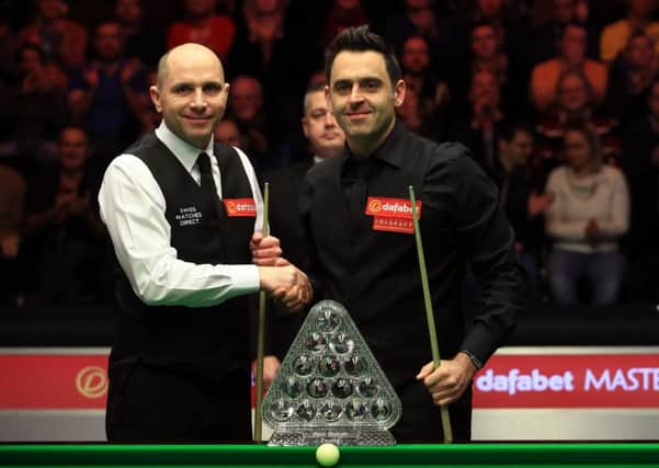 Joe Perry (left) and Ronnie O'Sullivan (right) pose for a photograph before the start of the Dafabet Masters final. Picture:  John Walton/PA Wire
