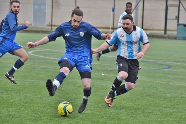 Action from Peterborough League Division Four as Premiair (stripes) beat Feeder FC 3-1. Photo: David Lowndes.