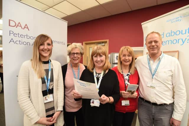 Lauren Weston, Barbara Thompson, Sophia Stanworth, Jane Frost and Kevin Boyer -  staff at the Alzheimer's Society   Dementia Resourse  open day at York Street. EMN-170114-174140009