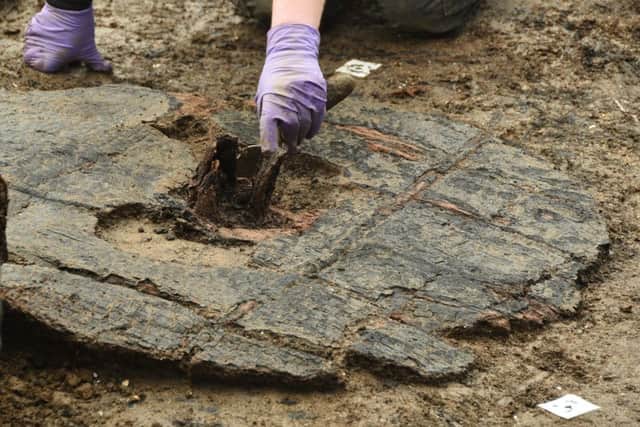Bronze Age wheel found at Must Farm archaeological dig at Kings Dyke. EMN-160218-133100009