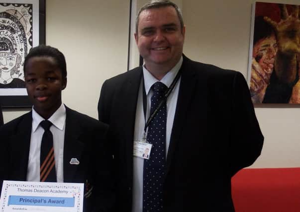 Lion Kheswa, who met Prince Charles this week and has also recieved an award from his school Principal, pictured right.