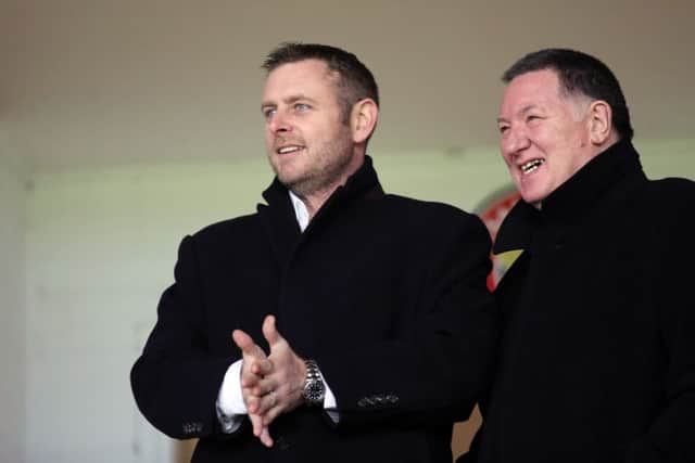 Posh chairman Darragh MacAnthony (left).