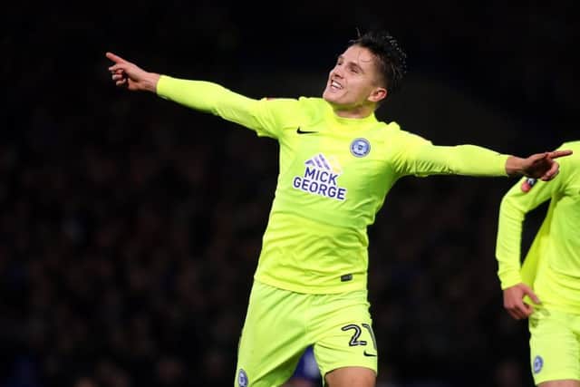 Posh striker Tom Nichols has a big fan in chairman Darragh MacAnthony.