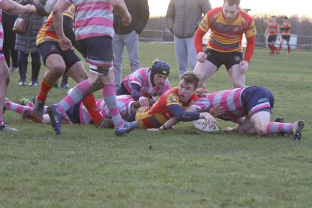 Tom Williams scores one of his three tries against Olney. Picture: Mick Sutterby