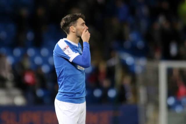 The dejected figure of Posh full-back Michael Smith after the 4-0 home defeat by MK Dons. Photo: Joe Dent/theposh.com.