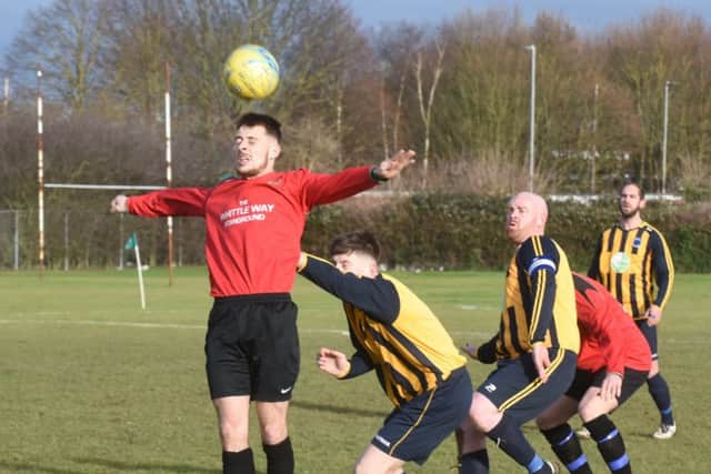 Action from AFC Stanground Sports A (red) v Bretton North End. Photo: David Lowndes.