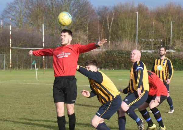 Action from AFC Stanground Sports A (red) v Bretton North End. Photo: David Lowndes.