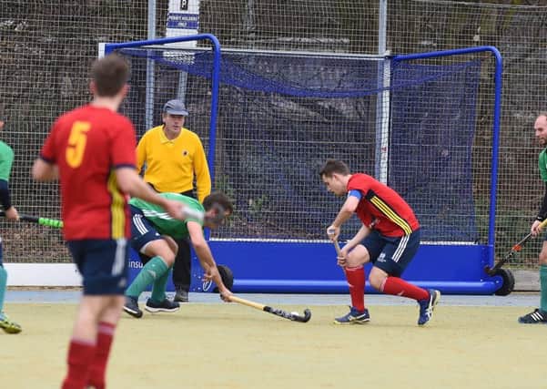 City of Peterborough skipper Ross Booth (red) in the thick of the action against Chelmsford. Photo: David Lowndes.