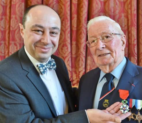 Legion of Honour medal presented to Eddie Hall (91) at Peterborough Town Hall by French honorary consulate Jean-Claude Lafontaine EMN-170129-090821009