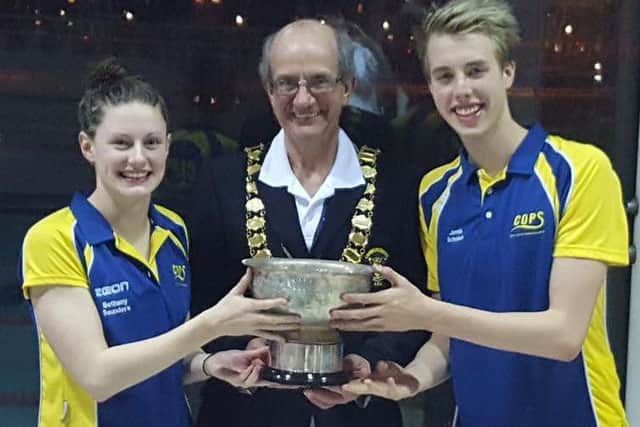 Rachel Wellings and Jamie Scholes collect the relays trophy.