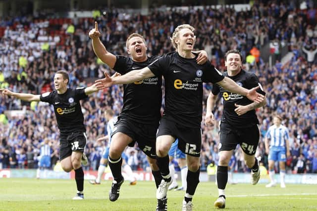 Craig Mackail-Smith celebrates his League One play-off final goal for Posh at Old Trafford in 2011.