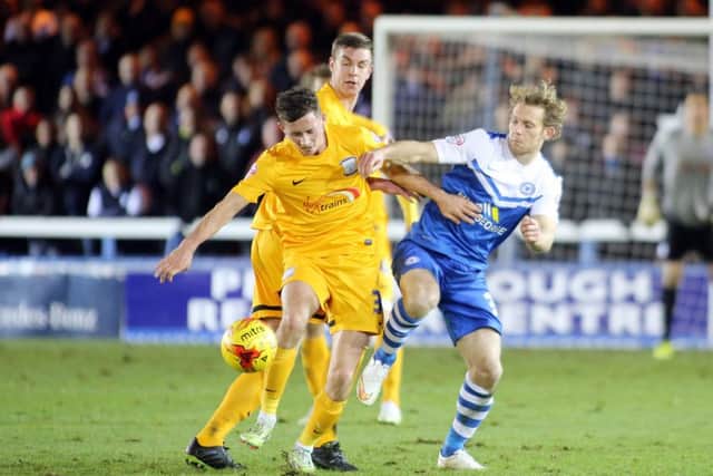 Craig Mackail-Smith in action for Posh against Preston.