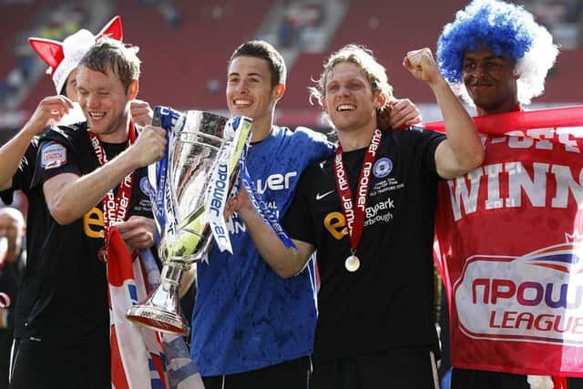 Latest Posh signing Craig Mackail-Smith (centre) and current manager Grant McCann (left) celebrate victory in the 2011 League One play-off final.