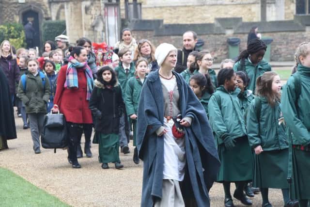 Katharine of Aragon service of commemoriation at Peterborough Cathedral. Local school children processing from St John's Church through city centre to the service. EMN-170127-165335009