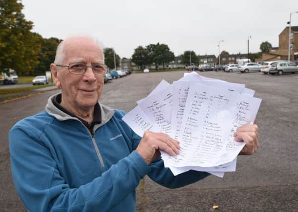 John Wood of Westwood with his petition against development of a nearby car park. EMN-150510-214220009