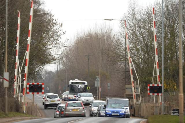 The A605 Kings Dyke railway crossing