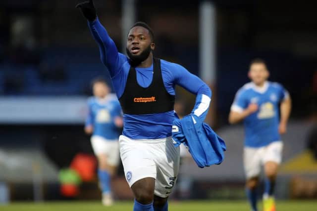 A great moment for Posh substitute Junior Morias after scoring the first Football League goal of his career at Port Vale. Photo: Joe Dent/theposh.com.