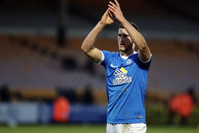 Posh central defender Dominic ball applauds the travelling fans after a 3-0 win at Port Vale. Photo: Joe Dent/theposh.com.