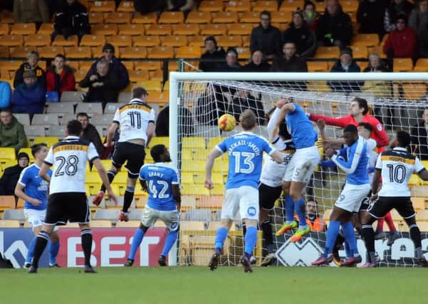 Posh defend another cross into their penalty area at Port Vale. Photo: Joe Dent/theposh.com.