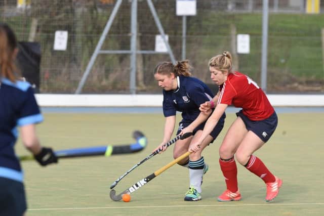 Anna Faux (red) in action for City of Peterborough Ladies during the 10-1 win over Colchester at Bretton Gate. Photo: David Lowndes.