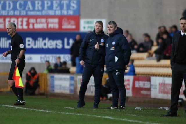 Posh manager Grant McCann and his assistant Lee Glover during the win at Port Vale. Photo: Joe Dent/theposh.com.