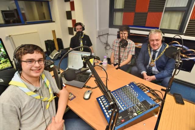 Simon Burgess, Aaron Horton and George Pollard (members of the youth media team) with Mayor David Sanders at the Cambs Scouts Hereward Radio station at Gladstone Community Centre. EMN-170118-163713009