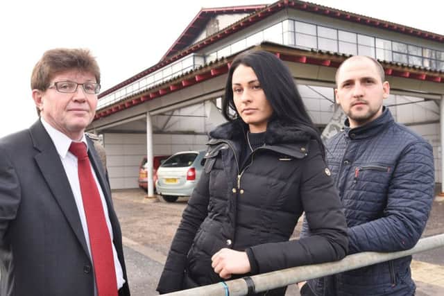 St Michael's Gate residents Lukasz Dudek and Julita Dzido outside Peterborough Crown Court for the county court hearing with Cllr Ed Murphy EMN-170602-141258009