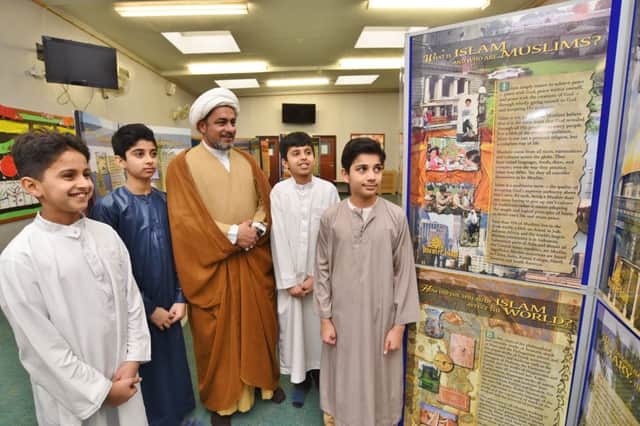 Open day at Husaini Islamic Centre at Burton Street. Imam  Shahnawaz Mahdavi with youngsters  Minhaal Ratansi, Ali Mavani, Muzzammil Jivras and Ali Afzal Mahdavi EMN-170502-162827009
