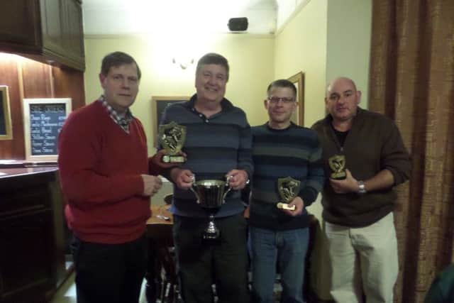 Ken Wade made the Cock Inn AC presentations. He is pictured presenting Mick Sidney with the 2016 club championship trophy.  From the left are Ken Wade, Mick Sidney, Chris Shortland (runner-up) and Steve Smith (third).