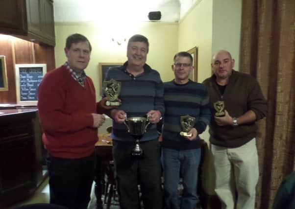 Ken Wade made the Cock Inn AC presentations. He is pictured presenting Mick Sidney with the 2016 club championship trophy.  From the left are Ken Wade, Mick Sidney, Chris Shortland (runner-up) and Steve Smith (third).