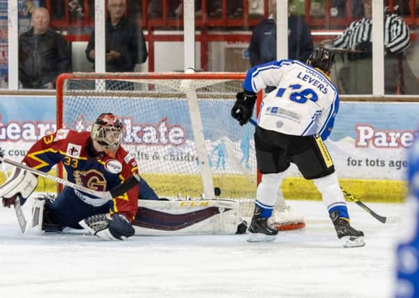 Marc Levers stikes to take the score  to 5-0 against Guildford. Picture: Tom Scott