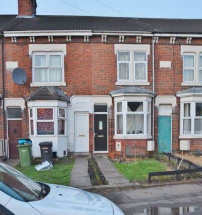 Police at drugs bust at Queen's Drive West. The house with white door is where officers were searching. EMN-170802-082917009