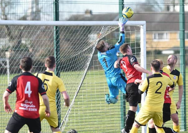 Action from Netherton United's Northants Junior Cup defeat at the hands of Raunds (yellow). Photo: David Lowndes.