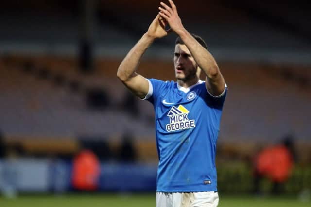 Posh centre-back Dominic Ball applauds the visiting fans at Port Vale. Photo: Joe Dent/theposh.com.
